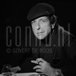 11-12-1985 Leonard Cohen in Rotterdam, The Netherlands. December 11, 1985.

[keywords]Posed, Headshot, Eye contact, Black & White image, Smoking[/keywords]